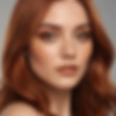 Close-up of a woman showcasing cinnamon copper hair against a soft background.