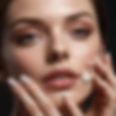 A close-up of a hand applying cream to the face, emphasizing texture and absorption