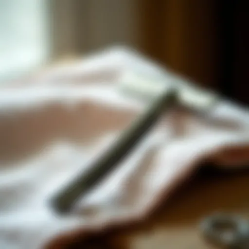 Close-up view of a straight razor on a soft cloth